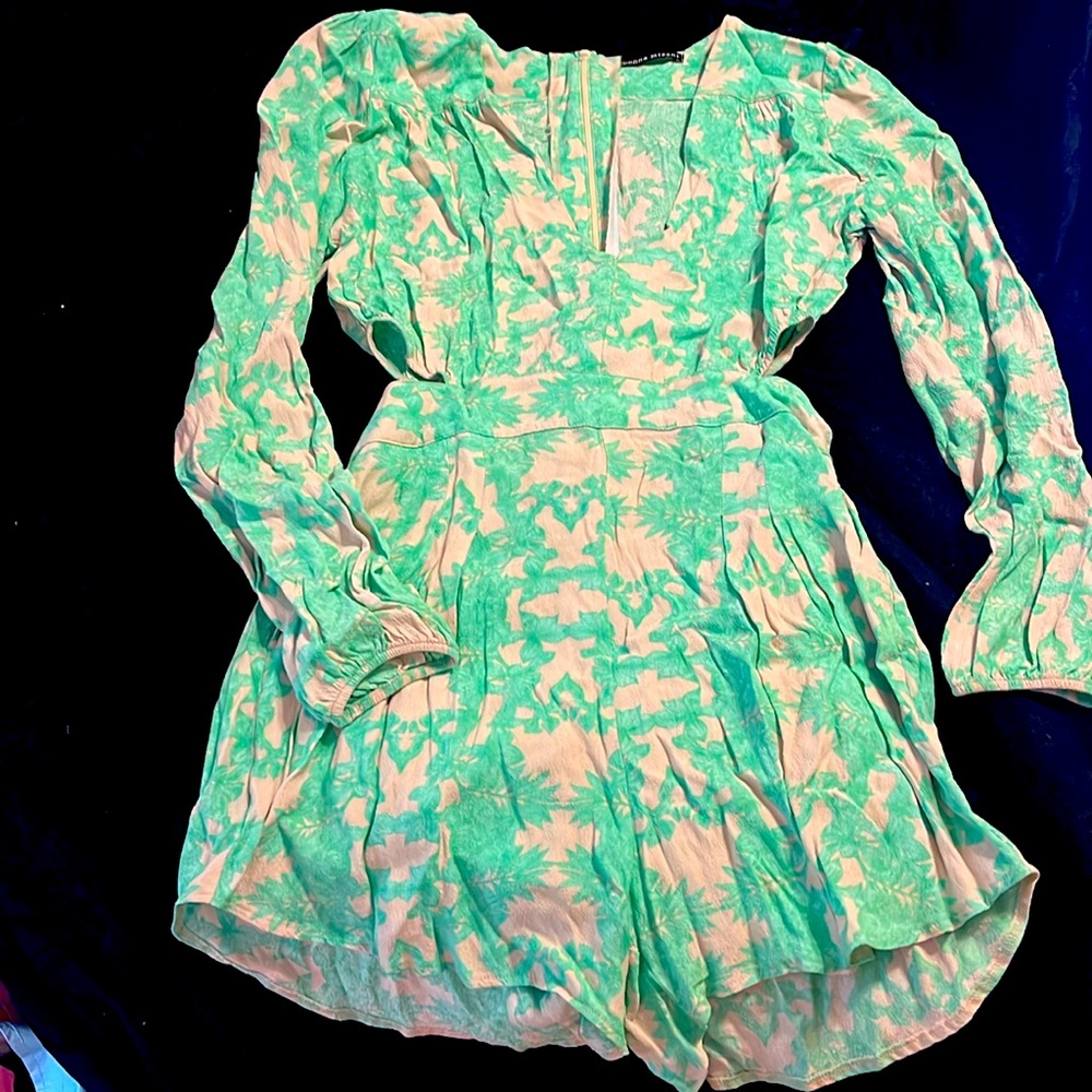 Gently used cut out shorts romper with sleeves and beautiful cuffs